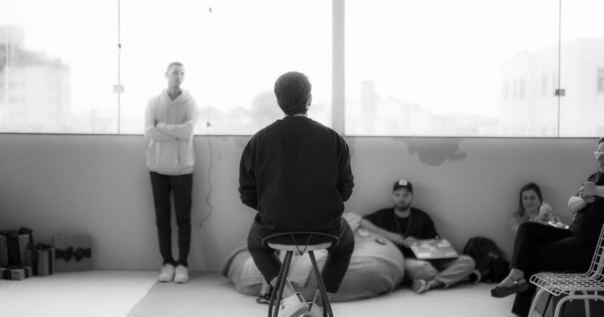 A small team sharing ideas in a creative workspace