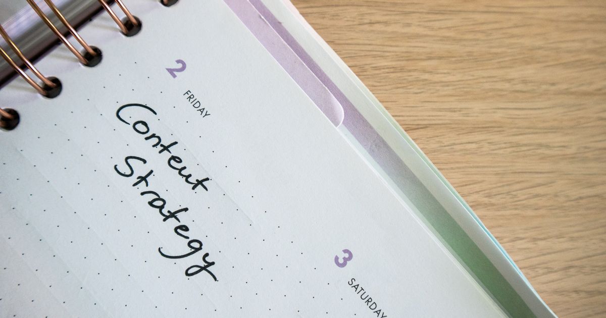 An open planner with handwritten content-strategy notes
