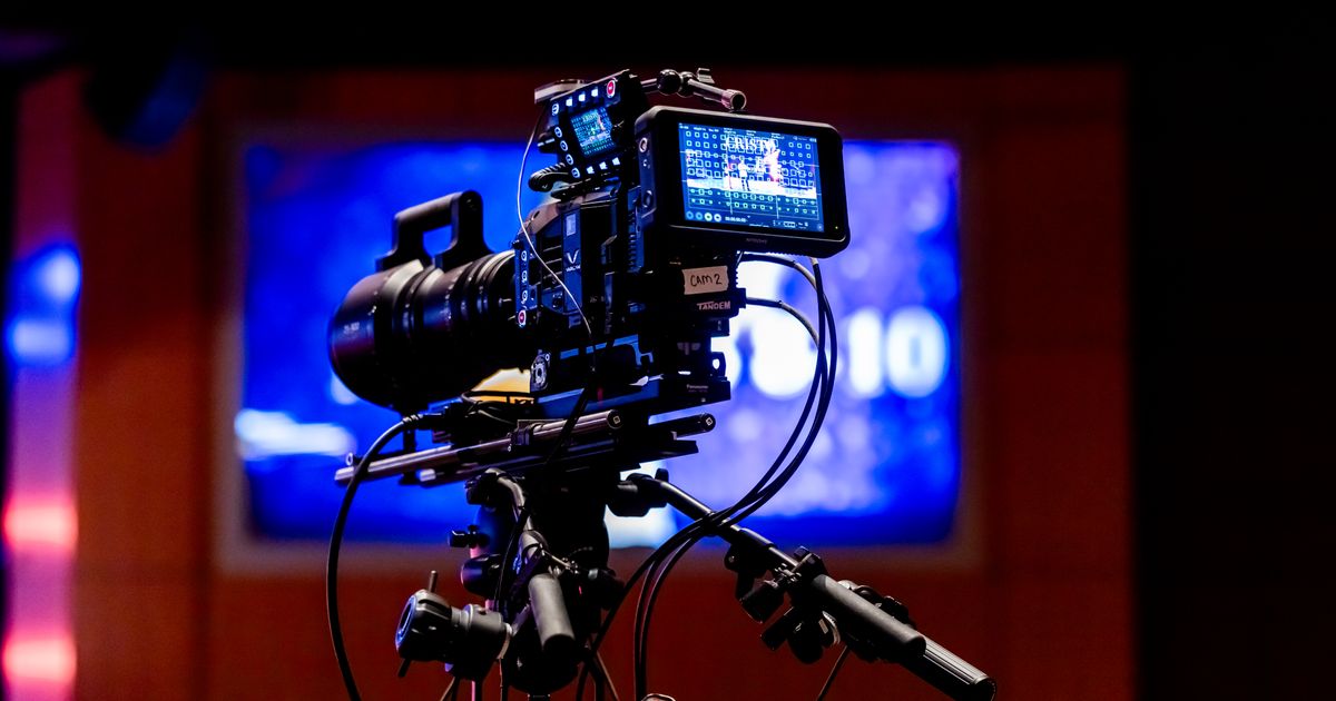 A professional video camera prepared for filming in a studio
